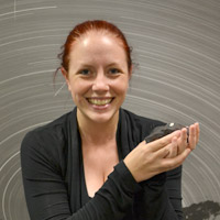 Gemma Mullaney holds a fragment of the Wiluna meteorite, a chondrite which was observed falling to Earth in 1967.